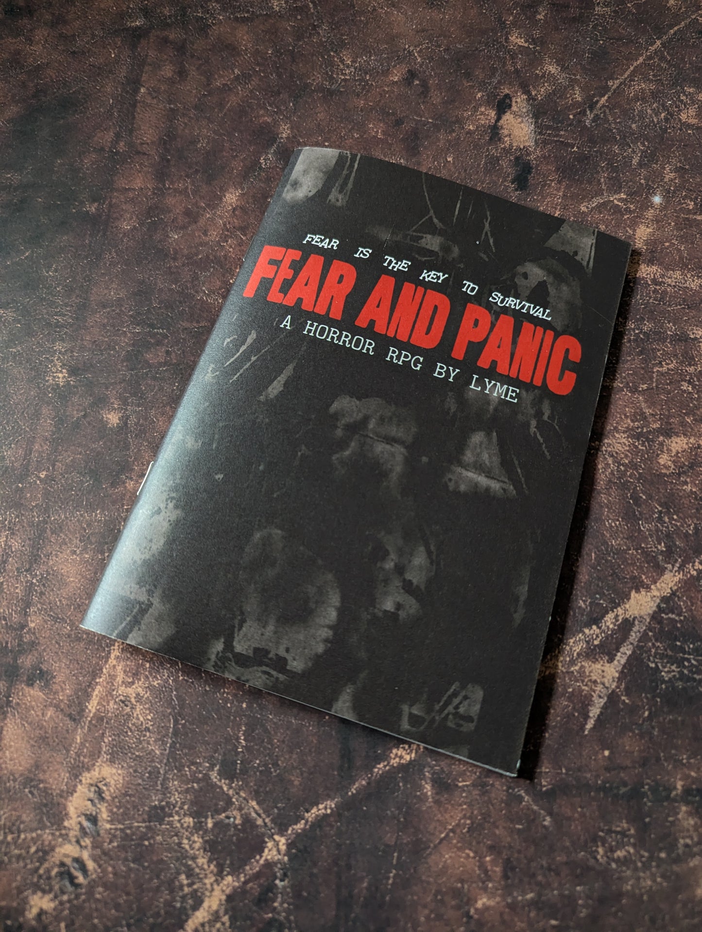 Cover of 'Fear and Panic' horror RPG by Lyme with text and dark imagery.
